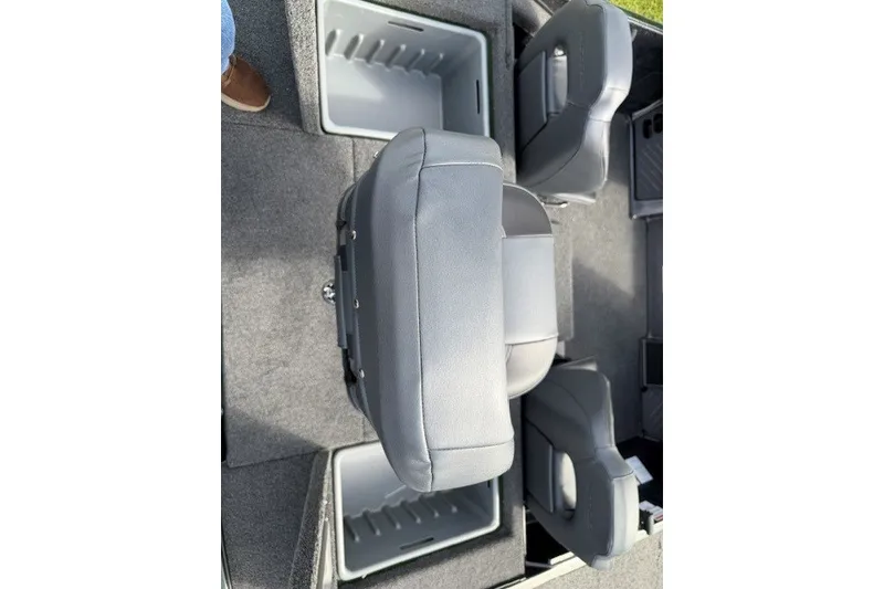 Slide: The Image of 2027 Nitro Z18 XL boat interior with gray seating and storage compartments. - 14