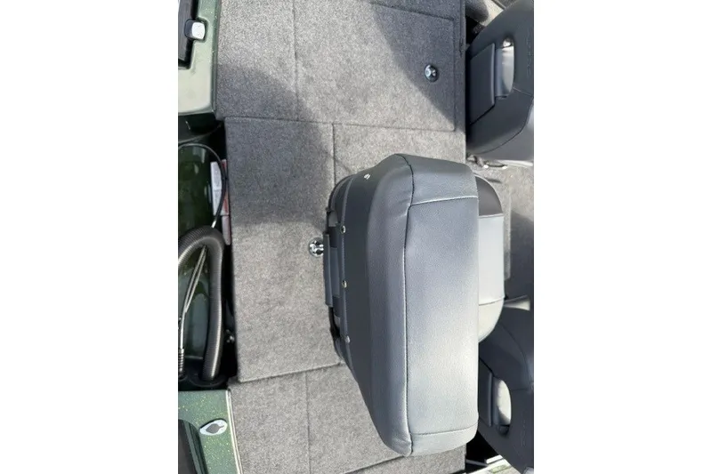 Slide: The Image of 2027 Nitro Z18 XL boat interior with gray seating and carpeted flooring. - 13