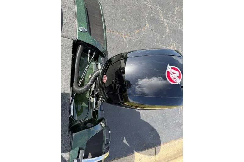 Slide: The Image of Top view of a 2027 Nitro Z18 XL boat engine on pavement. - 19