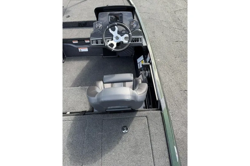 Slide: The Image of 2027 Nitro Z18 XL boat interior with steering wheel and seating. - 12