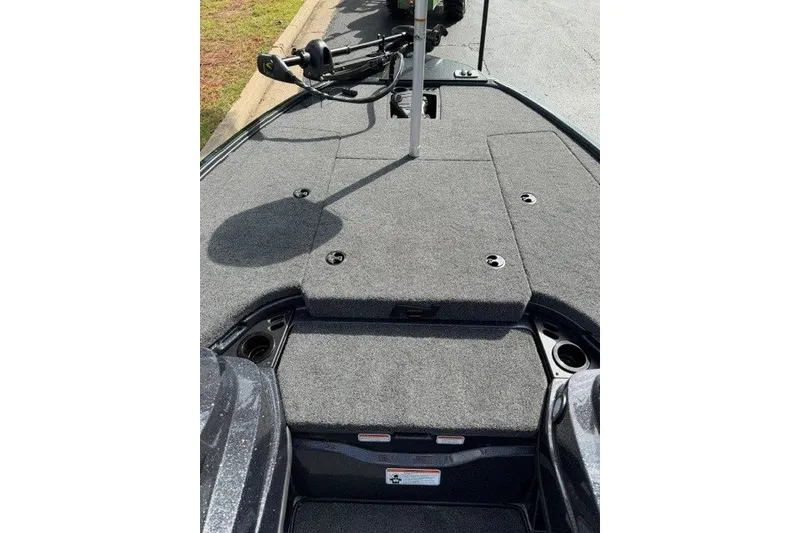 Slide: The Image of Front deck of 2027 Nitro Z18 XL boat with carpeted surface and storage compartments. - 7