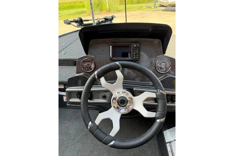 Slide: The Image of Steering wheel and dashboard of 2027 Nitro Z18 XL boat with navigation system. - 17