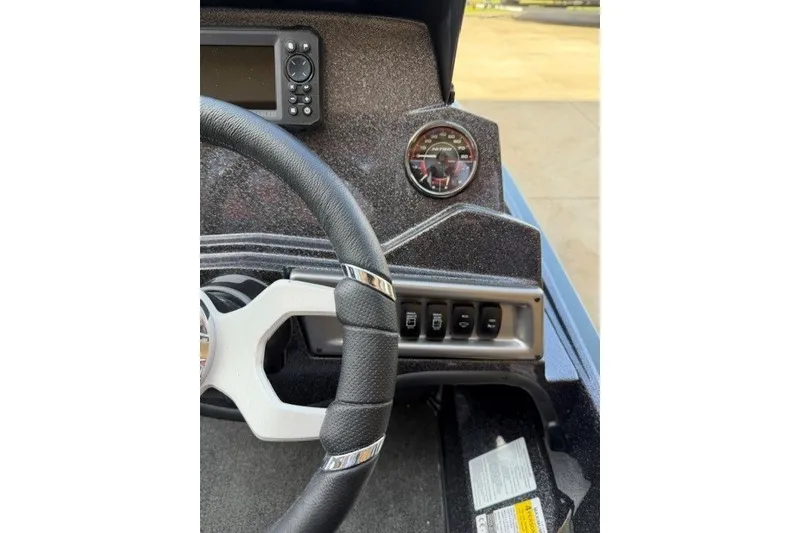 Slide: The Image of Steering wheel and dashboard of 2027 Nitro Z18 XL boat with gauges and controls. - 44