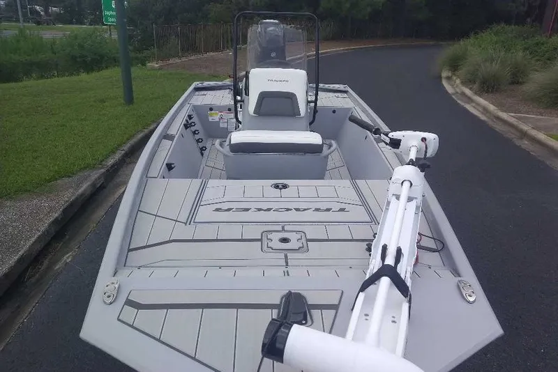 Slide: The Image of 2027 Tracker Bass Tracker Classic CC boat with trolling motor on a paved road. - 17