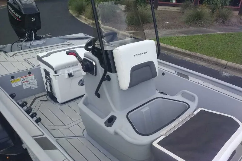 Slide: The Image of 2027 Tracker Bass Tracker Classic CC boat interior with seating and storage. - 16