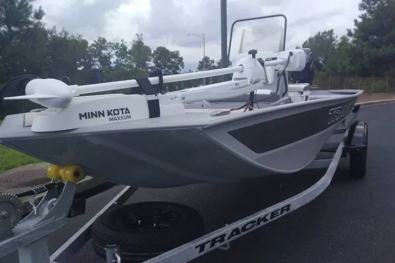 Slide: The Image of 2027 Tracker Bass Tracker Classic CC boat with Minn Kota Maxxum motor on trailer. - 18