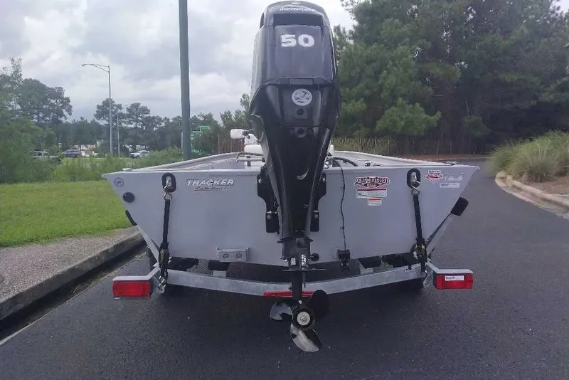 Slide: The Image of 2027 Tracker Bass Tracker Classic CC boat with 50 HP motor on trailer. - 14
