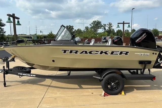 The Image of 2027 Tracker Pro Guide V-175 Combo boat on trailer, outdoors, side view. - 0