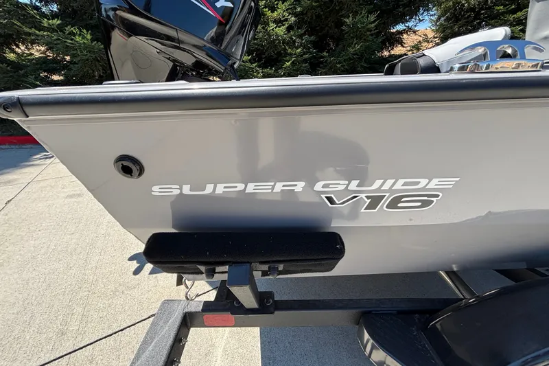 Slide: The Image of 2027 Tracker Super Guide V-16 SC boat on trailer, side view. - 14