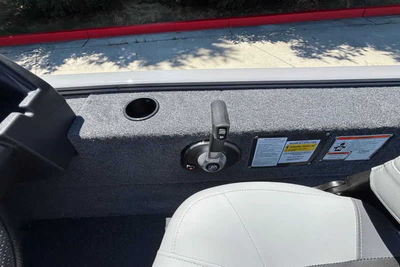 Slide: The Image of Interior of 2027 Tracker Super Guide V-16 SC boat with control lever and seat. - 20