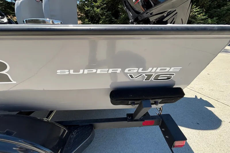 Slide: The Image of 2027 Tracker Super Guide V-16 SC boat on trailer, side view. - 13