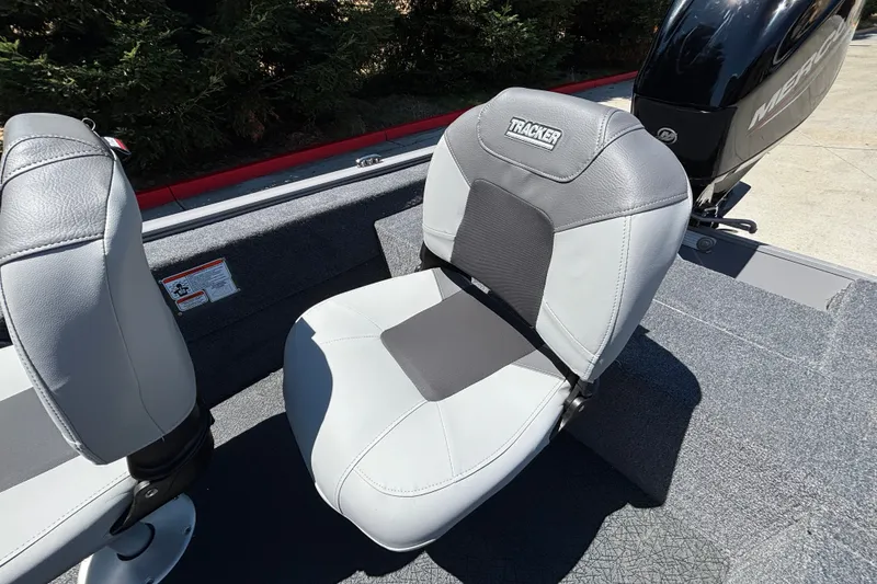 Slide: The Image of 2027 Tracker Super Guide V-16 SC boat seat with gray upholstery and logo. - 21