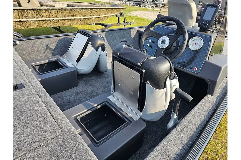 Slide: The Image of 2027 Tracker Bass Tracker Classic XL boat interior with steering wheel and storage compartments. - 15