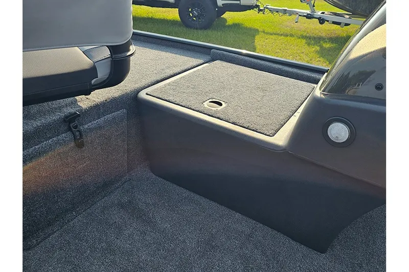 Slide: The Image of Interior of 2027 Tracker Bass Tracker Classic XL boat, featuring carpeted storage area. - 18