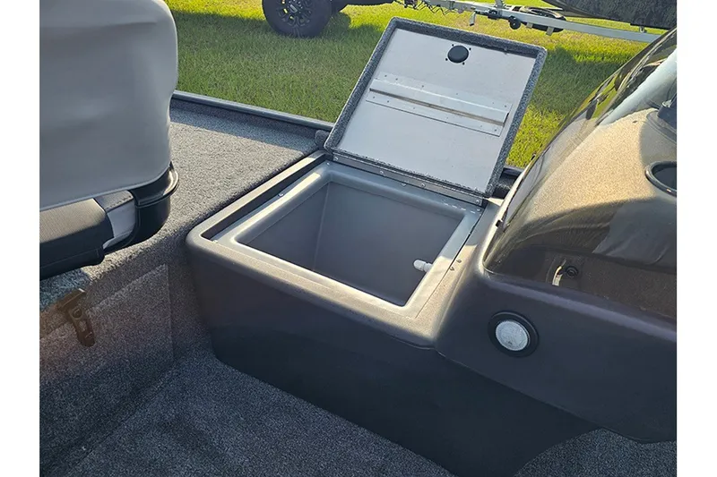 Slide: The Image of 2027 Tracker Bass Tracker Classic XL boat with open storage compartment, showcasing interior design. - 19