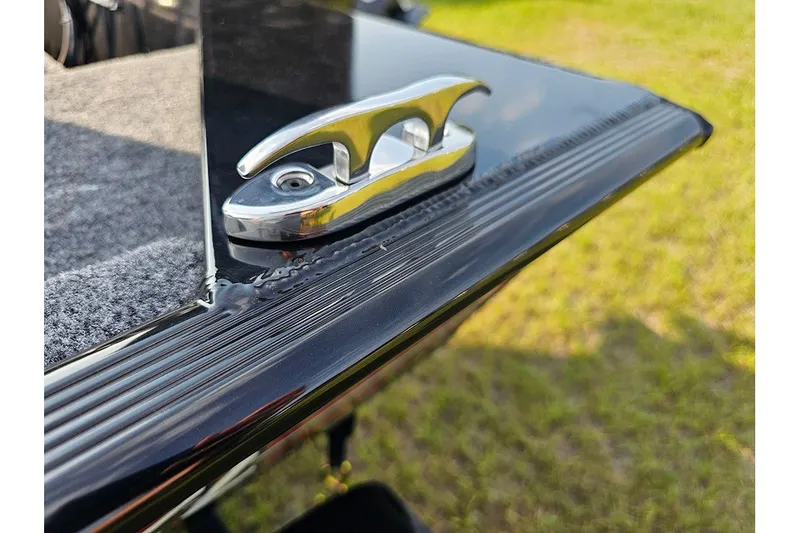 Slide: The Image of 2027 Tracker Bass Tracker Classic XL boat cleat on sleek black surface. - 22