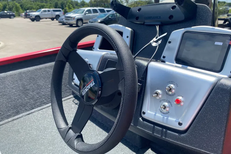 Slide: The Image of Steering wheel and dashboard of 2027 Tracker Pro Team 175 boat. - 17