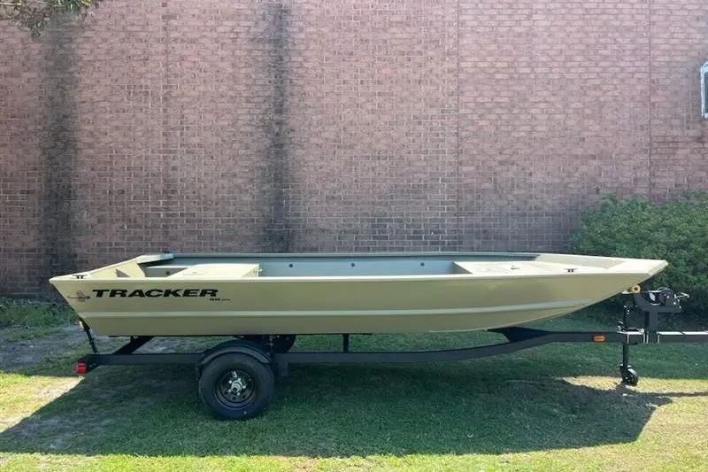 The Image of 2027 Tracker Grizzly 1648 Utility boat on trailer, parked outdoors. - 0