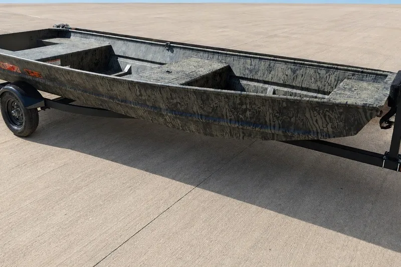 The Image of 2027 Tracker Grizzly 15 Jon boat on trailer, featuring a camouflage design. - 0