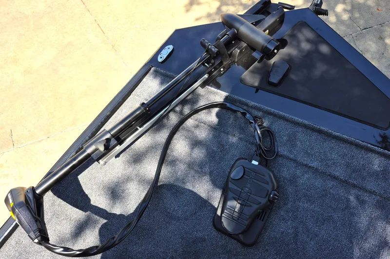 Slide: The Image of 2027 Tracker Bass Tracker Classic XL boat deck with trolling motor and foot pedal. - 14