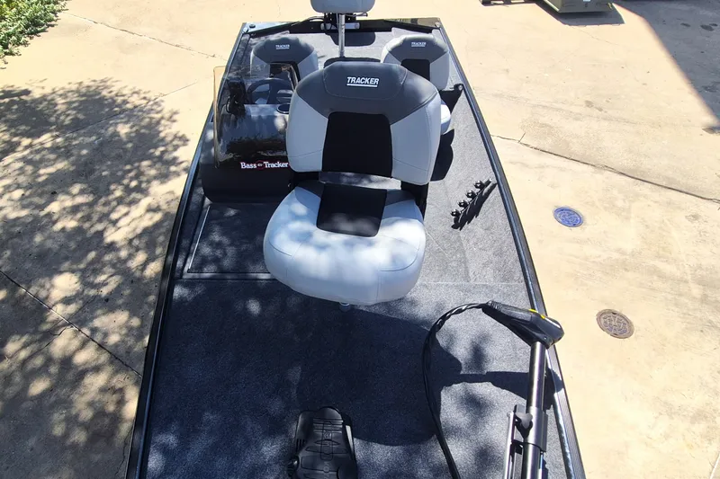 Slide: The Image of 2027 Tracker Bass Tracker Classic XL boat interior with seating and controls. - 13