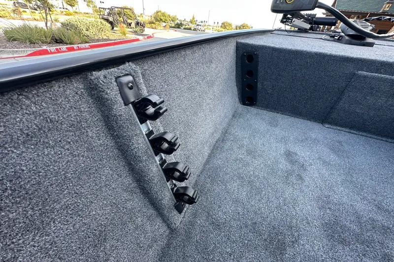 Slide: The Image of Interior of 2027 Tracker Bass Tracker Classic XL boat with rod holders and carpeted flooring. - 66