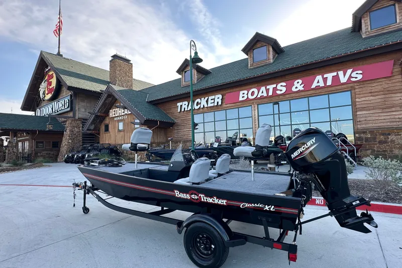 The Image of 2027 Tracker Bass Tracker Classic XL boat displayed outside a Tracker Boats & ATVs store. - 48
