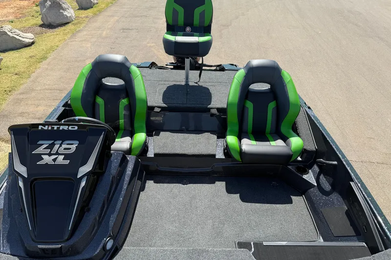 Slide: The Image of 2027 Nitro Z18 XL Pro boat interior with green and gray seats. - 27