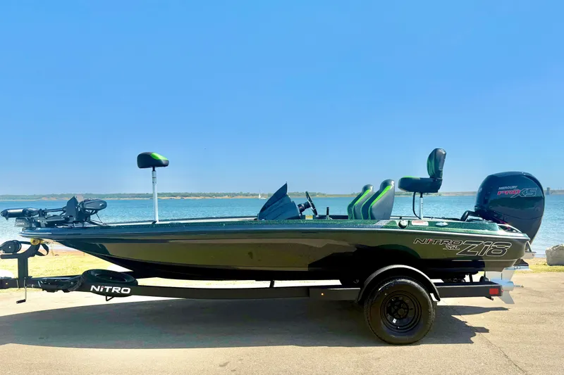 Slide: The Image of 2027 Nitro Z18 XL Pro boat by the water, showcasing sleek design and modern features. - 1
