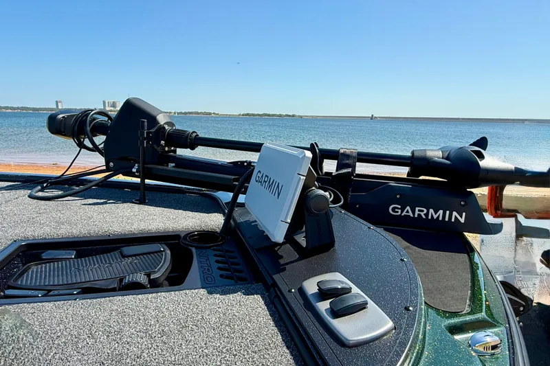 Slide: The Image of 2027 Nitro Z18 XL Pro boat with Garmin equipment by the water. - 6