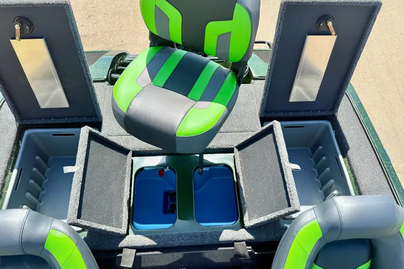 Slide: The Image of Interior of 2027 Nitro Z18 XL Pro boat with green and gray seating and storage compartments. - 23