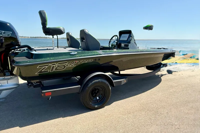 Slide: The Image of 2027 Nitro Z18 XL Pro boat on trailer by the water. - 4