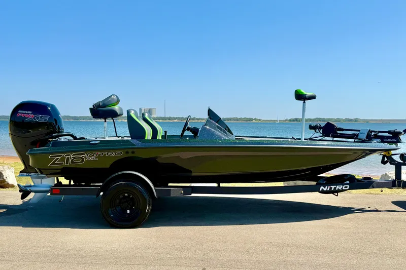 Slide: The Image of 2027 Nitro Z18 XL Pro boat by the water, featuring sleek design and modern features. - 10