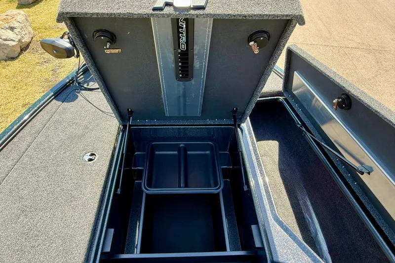 Slide: The Image of Open storage compartment of 2027 Nitro Z18 XL Pro boat, showcasing interior design. - 15