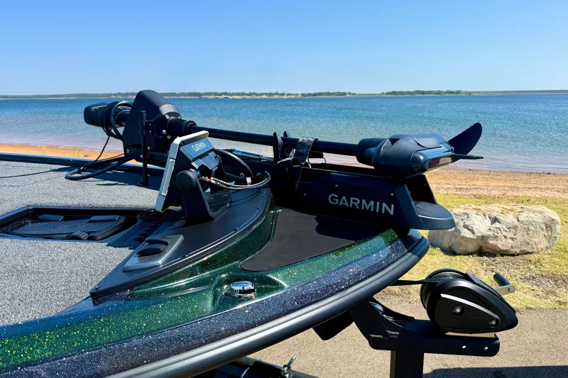 Slide: The Image of 2027 Nitro Z18 XL Pro boat with Garmin equipment by a serene lake. - 5