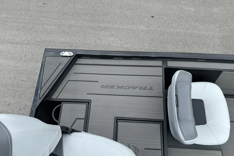 Slide: The Image of 2027 Tracker Pro 170 boat interior with gray seating and deck. - 23