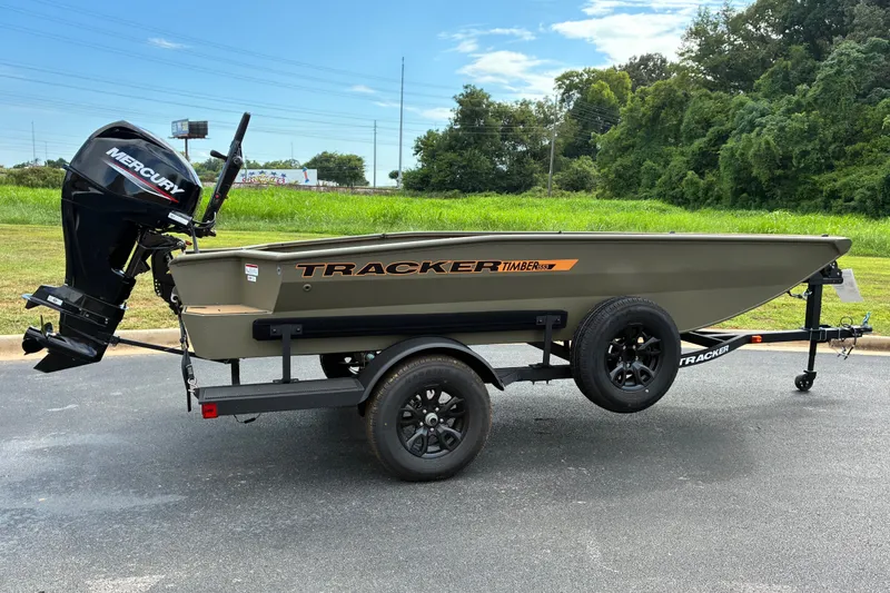 The Image of 2027 Tracker Grizzly 1553 Timber boat on trailer with Mercury outboard motor. - 0