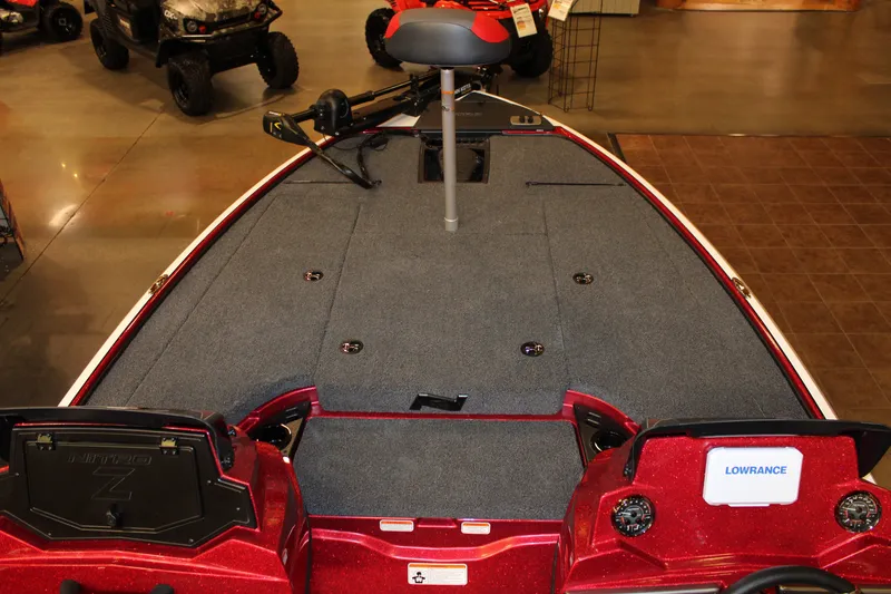 Slide: The Image of 2027 Nitro Z18 XL boat interior with carpeted deck and Lowrance electronics. - 4