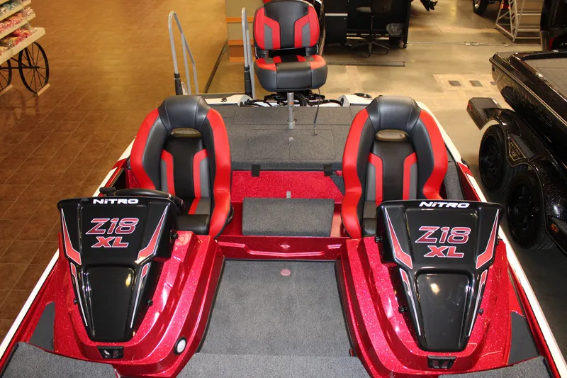 Slide: The Image of 2027 Nitro Z18 XL boat interior with red and black seating, showcasing sleek design. - 3