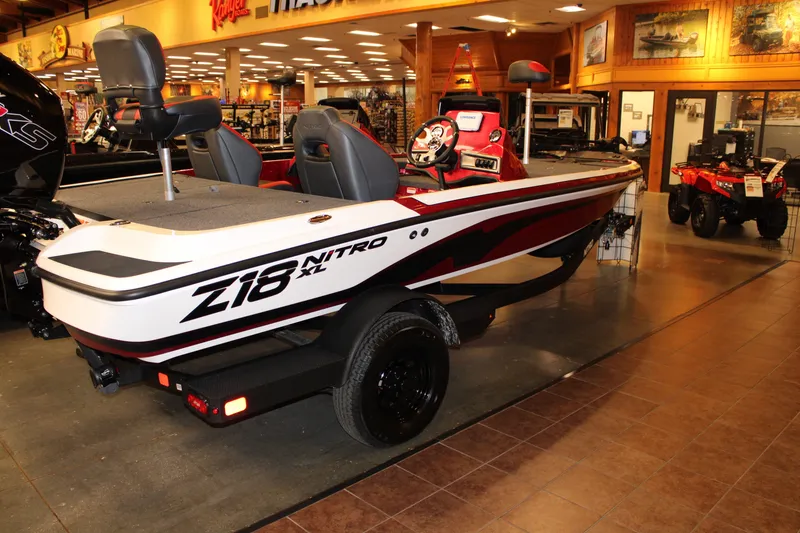 Slide: The Image of 2027 Nitro Z18 XL boat displayed indoors, showcasing sleek design and modern features. - 2