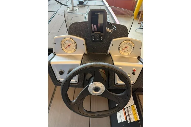 Slide: The Image of Steering console of 2027 Tracker Pro 170 boat with gauges and Garmin device. - 13