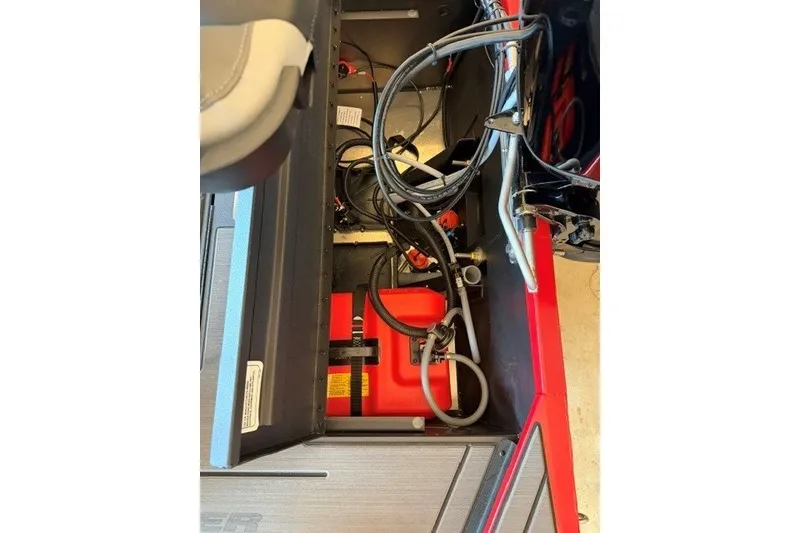 Slide: The Image of Interior view of a 2027 Tracker Pro 170 boat showing wiring and components. - 16