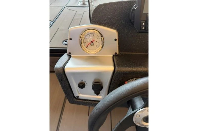 Slide: The Image of 2027 Tracker Pro 170 dashboard with RPM gauge and controls. - 14