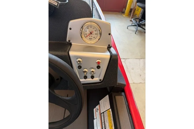 Slide: The Image of Dashboard of a 2027 Tracker Pro 170 boat with speedometer and controls. - 15