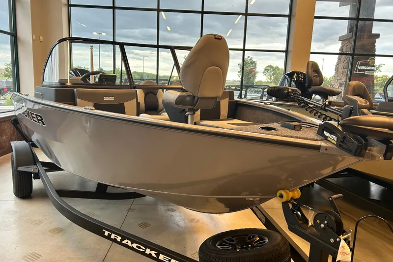 The Image of 2027 Tracker Pro Guide V-175 Combo boat displayed indoors, showcasing sleek design and modern features. - 0
