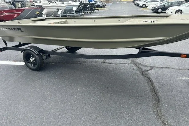 The Image of 2027 Tracker Grizzly 1648 Utility boat on trailer in parking lot. - 0