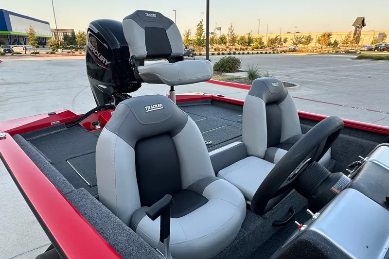 Slide: The Image of 2027 Tracker Pro Team 175 boat interior with comfortable seating and Mercury engine. - 20