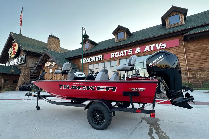 The Image of 2027 Tracker Pro Team 175 boat displayed outside a Tracker Boats & ATVs store. - 1