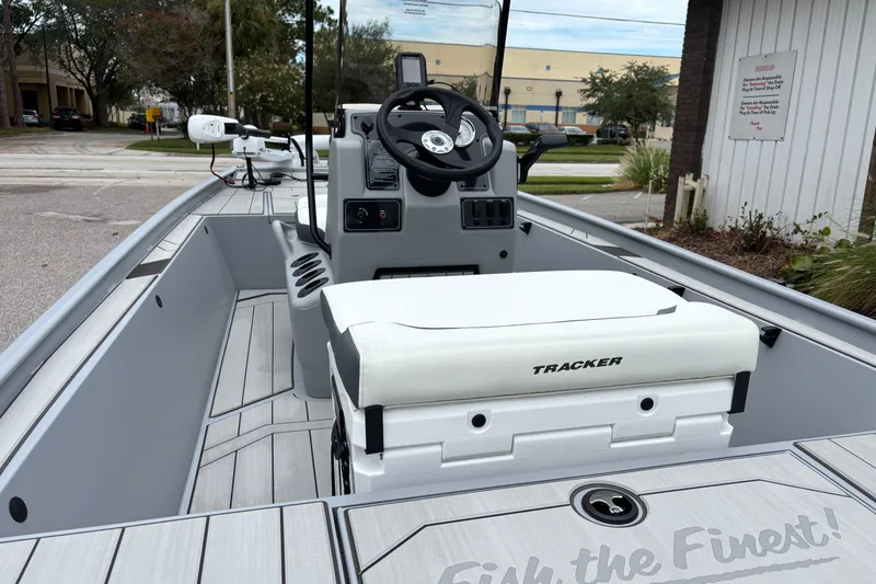 Slide: The Image of 2027 Tracker Bass Tracker Classic CC boat interior with steering console and seating. - 44