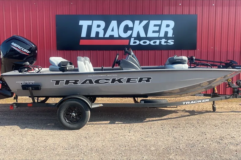 The Image of 2027 Tracker Pro Team 175 boat displayed outside Tracker Boats dealership. - 0